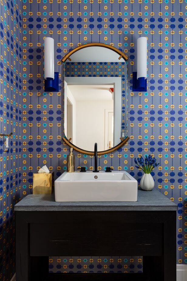A powder room is a great space for experimenting with bold patterns and colors: Because it’s small, it’s requires less of an investment, and you’ll likely spend much less time there than in other rooms.
